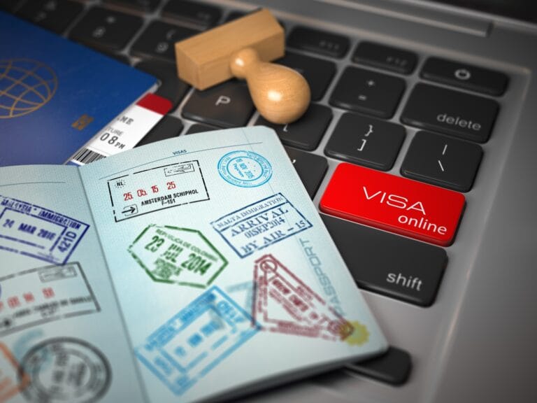 visa-online-application-concept-open-passport-with-visa-stamps.jpg